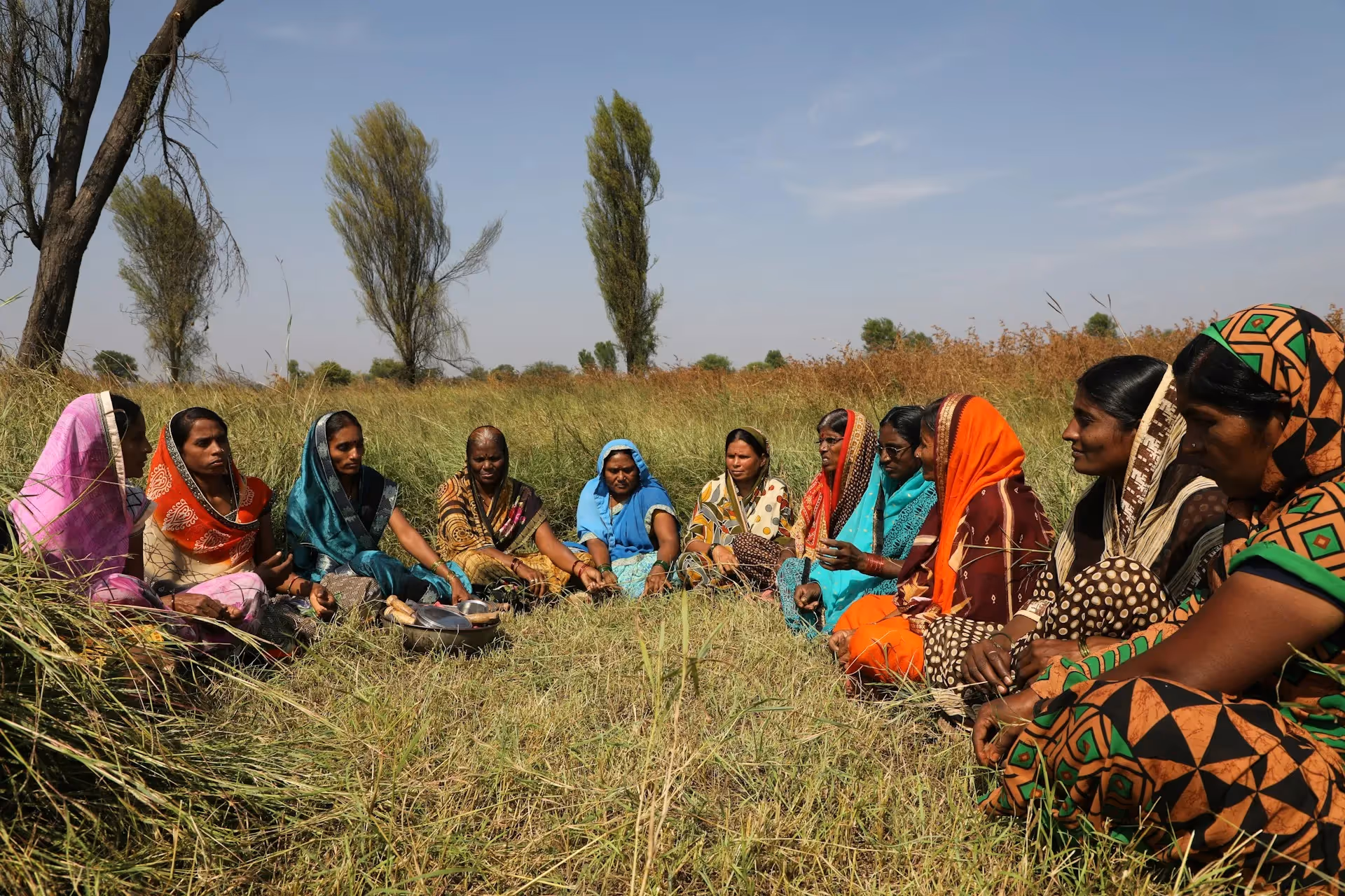 Group of women seating in circle - Photo by Amol Sonar